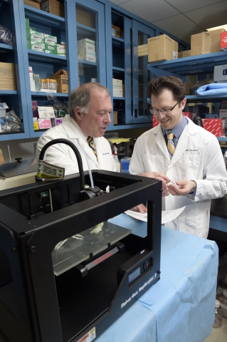 Daniel A. Grande, PhD, director of the Orthopedic Research Laboratory at the Feinstein Institute, and Todd Goldstein, an investigator at the Feinstein Institute, part of the North Shore-LIJ Health System, with their MakerBot Replicator Desktop 3D Printer that they used to 3D print cartilage to repair tracheal damage.