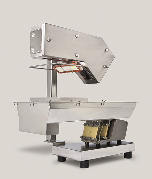 Shown mounted on a vibrating tray is an ARBOmeter, designed and manufactured by Anubis Manufacturing Consulting Corporation, for measuring particulate flow (Source: Anubis).